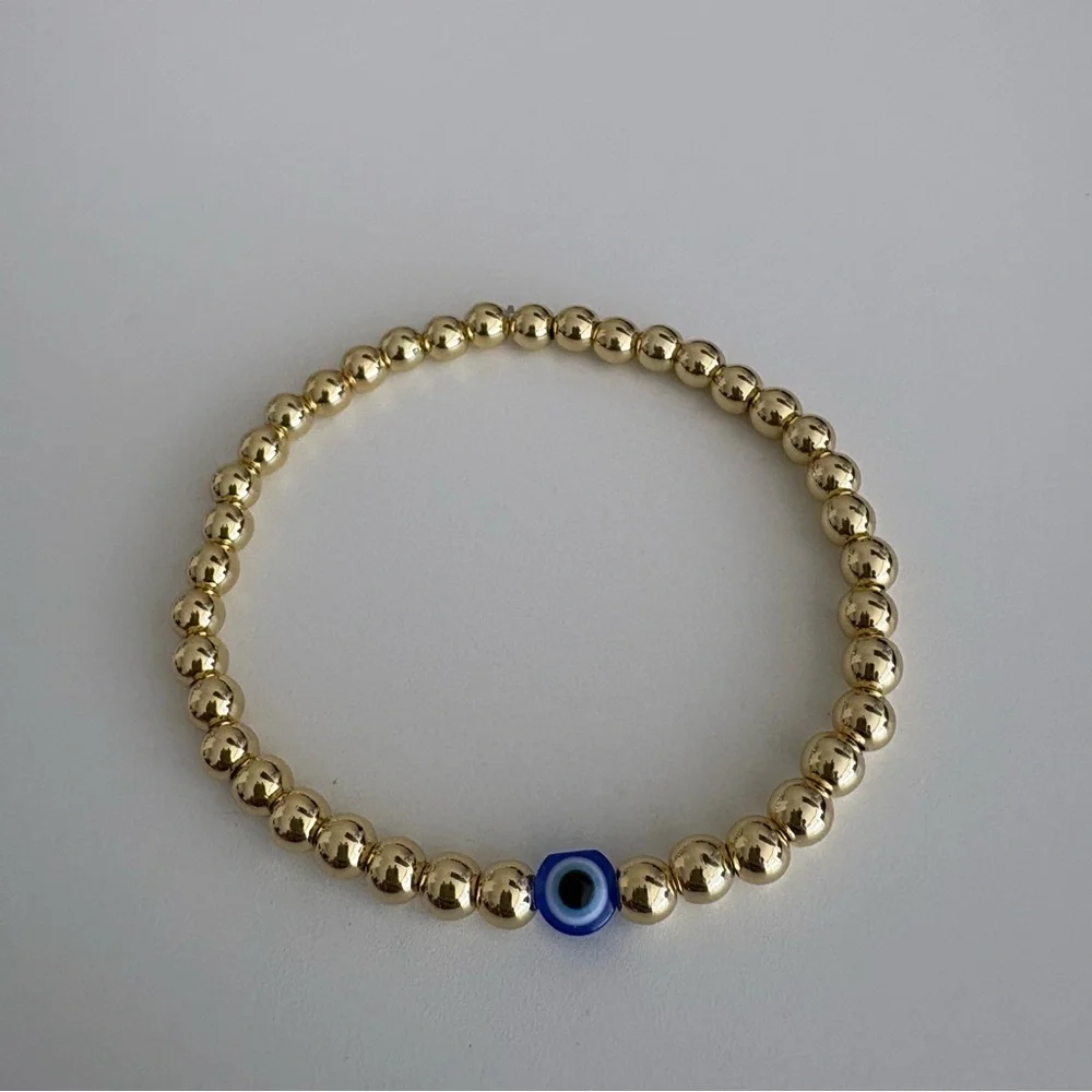 Gold Beaded Bracelet with Blue Evil Eye Bead